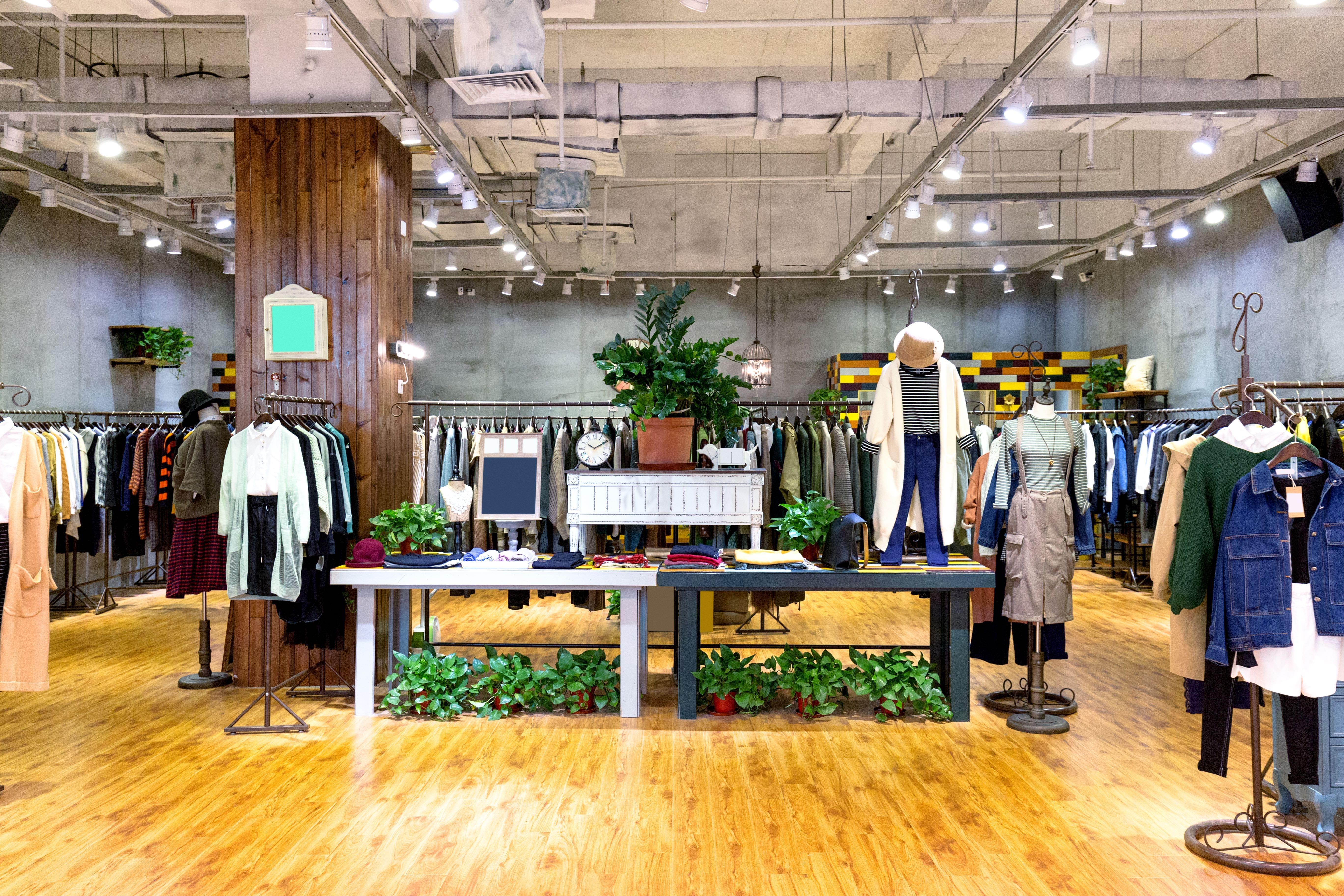 Retail shop with mannequins, hangers and rails